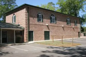 A Brick Wall Building With Wooden Doors
