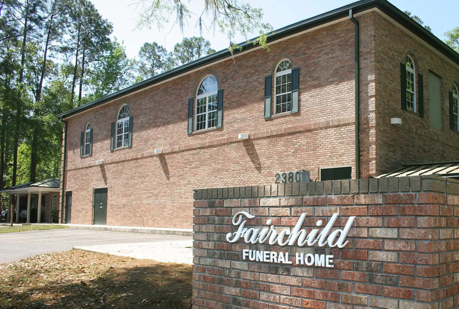 Fairchild Funeral Home Board Brick Wall